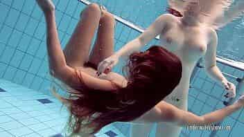 Katrin swims and strips Lucy in the swimming pool