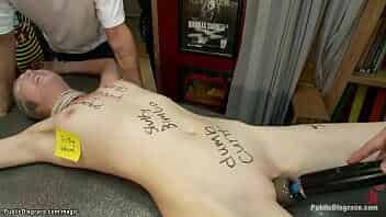 Filthy brunette slut Coral Aorta is tied by domme Princess Donna Dolore and ass fucked with dick on a stick then anal gangbang fucked in public tattoo shop by big cock Mr Pete