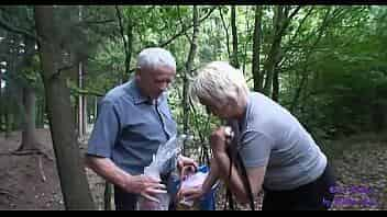 The young girl meets an elderly married couple fucking in the woods